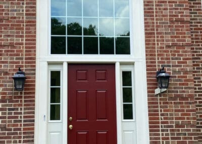 Red Door with Arched Window Above